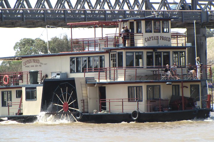 Captain Proud cruising under the bridge