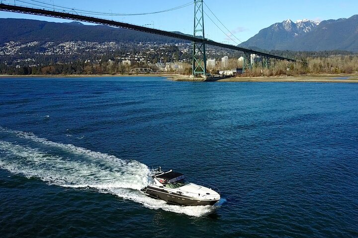 Vancouver sightseeing boat tour. The iconic Lions Gate bridge in the background.