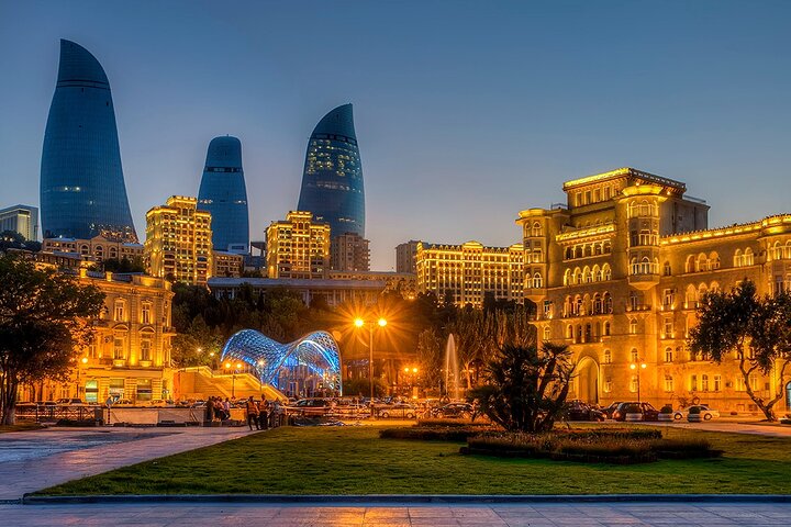 Entrance to the Baku Funicular, with the iconic Flame Towers illuminated in the background.
