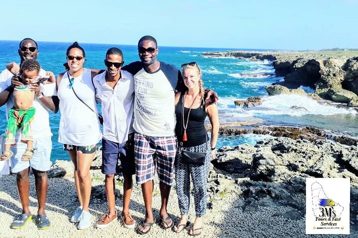 At the Animal Flower Cave enjoying the scenery behind us while doing A Private Customised Island Tour 