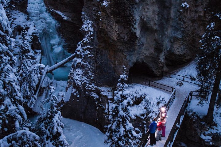See frozen falls lit by a headlamp